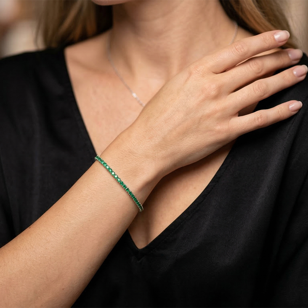 2mm green zircon 925 silver tennis bracelet on a display surface